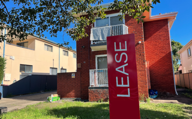 Small apartment block with a Lease sign out the front